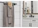 Tastefully designed bathroom details featuring soft towels, elegant hardware, and shiplap wall accents at 1160 E Peach Tree Dr, Chandler, AZ 85249