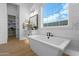 Bright bathroom with soaking tub, double vanity, and lots of natural light at 1160 E Peach Tree Dr, Chandler, AZ 85249