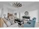 Inviting living room with modern decor, comfortable sofas, and a seamless transition to the dining area at 1160 E Peach Tree Dr, Chandler, AZ 85249