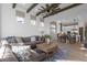 Open concept living space featuring a comfortable sofa, kitchen views, and stylish decor at 1160 E Peach Tree Dr, Chandler, AZ 85249