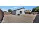 Expansive gravel backyard featuring a mix of textures, surrounded by block fencing for privacy at 1225 N 159Th Ln, Goodyear, AZ 85338