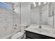 Well-lit bathroom with tiled shower and a modern vanity at 1225 N 159Th Ln, Goodyear, AZ 85338