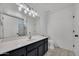 Bathroom with marble floors, modern vanity, mirror and lighting at 1225 N 159Th Ln, Goodyear, AZ 85338