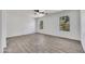 Spacious bedroom features wood-look tile flooring and natural light from two windows at 1225 N 159Th Ln, Goodyear, AZ 85338