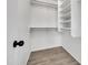 Bright closet with built in shelves and racks at 1225 N 159Th Ln, Goodyear, AZ 85338