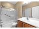 Bathroom featuring a shower with glass door, vanity with sink, and a toilet at 12945 W Yellow Bird Ln, Peoria, AZ 85383