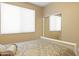 Comfortable bedroom with a well-made bed and a closet with mirrored doors at 12945 W Yellow Bird Ln, Peoria, AZ 85383