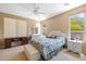 Comfortable bedroom featuring neutral tones, a comfortable queen bed and ample natural light at 12945 W Yellow Bird Ln, Peoria, AZ 85383