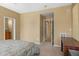 Cozy bedroom featuring neutral walls, carpet, and doorways leading to other rooms at 12945 W Yellow Bird Ln, Peoria, AZ 85383