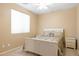 Bright bedroom featuring a bed, a nightstand, and a window for plenty of light at 12945 W Yellow Bird Ln, Peoria, AZ 85383