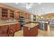 Well-lit kitchen with stainless steel appliances, granite countertops, and center island at 12945 W Yellow Bird Ln, Peoria, AZ 85383