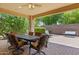Covered patio with dining table and chairs, perfect for outdoor entertaining and relaxation at 12945 W Yellow Bird Ln, Peoria, AZ 85383