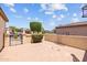 Walled patio with attractive brick pavers, offering a private outdoor area with access to the main house at 12945 W Yellow Bird Ln, Peoria, AZ 85383