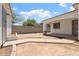 A view of a backyard patio with a block wall in the distance at 1510 W Fillmore St, Phoenix, AZ 85007