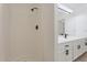 Bright bathroom featuring a tiled shower and a double sink vanity with modern, black fixtures at 1510 W Fillmore St, Phoenix, AZ 85007