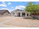 Charming single-story home featuring white stucco, front porch, and low-maintenance desert landscaping at 1510 W Fillmore St, Phoenix, AZ 85007