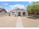 Charming single-story home featuring white stucco, front porch, and low-maintenance desert landscaping at 1510 W Fillmore St, Phoenix, AZ 85007