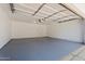 Spacious three-car garage with epoxy flooring and ample overhead storage for vehicles and equipment at 1510 W Fillmore St, Phoenix, AZ 85007