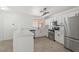 Modern kitchen features white cabinets, stainless steel appliances, quartz countertops and tile floors at 1510 W Fillmore St, Phoenix, AZ 85007