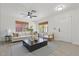 Staged living room showcasing modern furniture, light-colored walls, and tile floors at 1510 W Fillmore St, Phoenix, AZ 85007