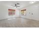 Bright, open living room featuring tile floors, neutral walls and large windows, creating an airy atmosphere at 1510 W Fillmore St, Phoenix, AZ 85007