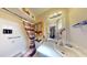 Bathroom with a shower, vanity, decorative mirror, and ample cabinet space at 1710 W 13Th Ave, Apache Junction, AZ 85120