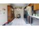Spacious kitchen showcasing stainless steel appliances, dark wood cabinetry, and decorative shelving, plus a built-in hutch at 1710 W 13Th Ave, Apache Junction, AZ 85120