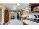 Bright kitchen featuring wooden cabinets, white countertops, stainless steel appliances, and unique decorative touches throughout at 1710 W 13Th Ave, Apache Junction, AZ 85120