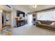 Comfortable living room with plush carpeting, a cozy sofa, and natural light at 1710 W 13Th Ave, Apache Junction, AZ 85120
