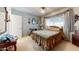 Comfortable bedroom with a queen-sized bed, soft carpet, and bright window coverings at 1710 W 13Th Ave, Apache Junction, AZ 85120