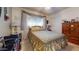 Comfortable bedroom with a queen-sized bed, soft carpet, bright window coverings, and closet at 1710 W 13Th Ave, Apache Junction, AZ 85120
