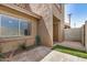 Cozy backyard space featuring brick pavers, artificial turf, and access to the building at 222 W Brown Rd # 14, Mesa, AZ 85201