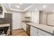 Bright kitchen featuring white cabinets, stainless steel appliances, and ample counter space at 222 W Brown Rd # 14, Mesa, AZ 85201