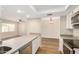 Open floor plan kitchen with breakfast bar, dining area, and living room views at 222 W Brown Rd # 14, Mesa, AZ 85201