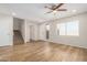 Bright living room with wood flooring, staircase and a large window offering natural light at 222 W Brown Rd # 14, Mesa, AZ 85201
