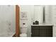 Contemporary bathroom with marble-look shower, framed art, and dark vanity at 25576 N 174Th Dr, Surprise, AZ 85387
