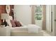 Cozy bedroom featuring a comfortable bed, a modern nightstand, and stylish decor at 25576 N 174Th Dr, Surprise, AZ 85387