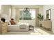 This bedroom offers a neutral palette, large window, and natural light, creating a relaxing retreat at 25576 N 174Th Dr, Surprise, AZ 85387