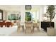 Bright dining area with sleek chairs and a view into the living room, creating an open, inviting space at 25576 N 174Th Dr, Surprise, AZ 85387