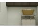 Laundry room includes built in wire shelving and a sorting hamper for convenience and organization at 25576 N 174Th Dr, Surprise, AZ 85387