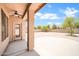 Covered back patio with a ceiling fan overlooking a spacious backyard at 2605 W Darrel Rd, Phoenix, AZ 85041