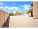 Spacious backyard featuring a privacy wall and low-maintenance desert landscaping at 2605 W Darrel Rd, Phoenix, AZ 85041