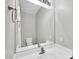 Bathroom vanity featuring a sink, mirror, modern faucet, and light fixtures at 2605 W Darrel Rd, Phoenix, AZ 85041
