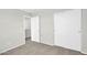Neutral bedroom featuring carpet, gray walls, and a sliding door closet at 2605 W Darrel Rd, Phoenix, AZ 85041