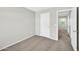 Neutral bedroom featuring carpet, gray walls, and a door to an adjacent room at 2605 W Darrel Rd, Phoenix, AZ 85041