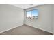 Bright bedroom featuring a large window and neutral decor at 2605 W Darrel Rd, Phoenix, AZ 85041