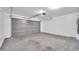 Spacious two-car garage with an automatic door opener and concrete floor at 2605 W Darrel Rd, Phoenix, AZ 85041
