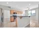 Bright kitchen features stainless steel appliances, tile floors, and ample cabinet space at 2605 W Darrel Rd, Phoenix, AZ 85041