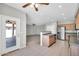 Open kitchen area with tile floors, stainless steel appliances, and ceiling fan at 2605 W Darrel Rd, Phoenix, AZ 85041