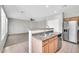 Bright kitchen features stainless steel appliances, tile floors, and plentiful cabinet space at 2605 W Darrel Rd, Phoenix, AZ 85041